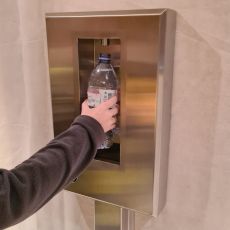 foot operated bottle filler in use